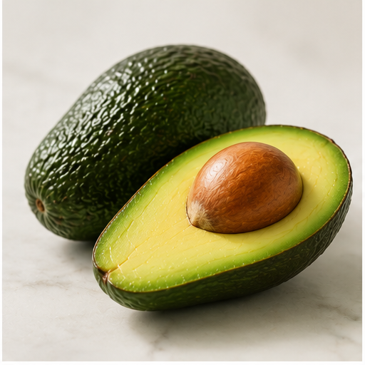 A whole avocado with dark green, textured skin next to a half avocado showing smooth, light green flesh and a large brown seed on a light surface.